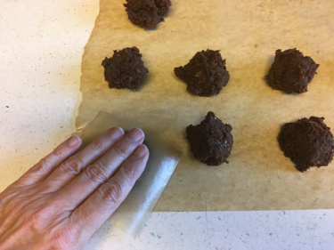 pressing amazeballs into amazing cookies
